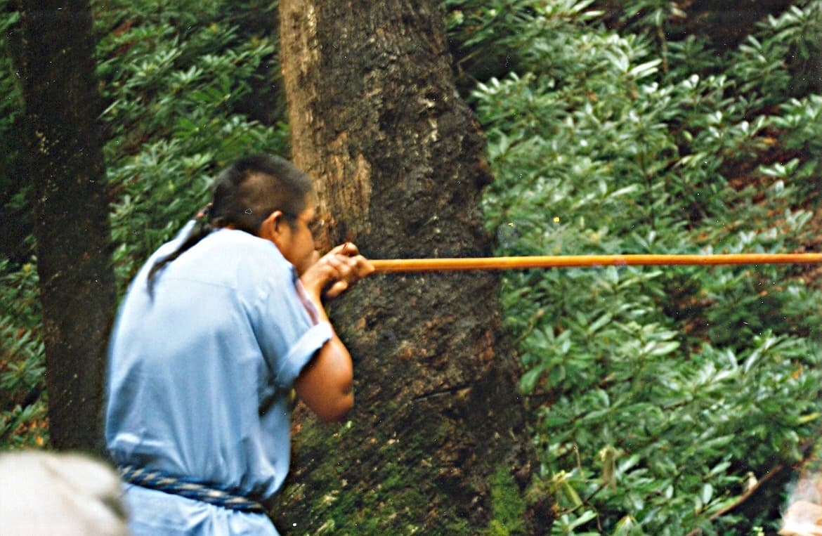 Oconaluftee River Trail — Blowgun_demonstration_in_Oconaluftee_Indian_Village,_Cherokee,_North_Carolina.jpg